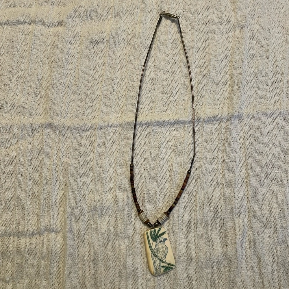 Necklace with bird pendant